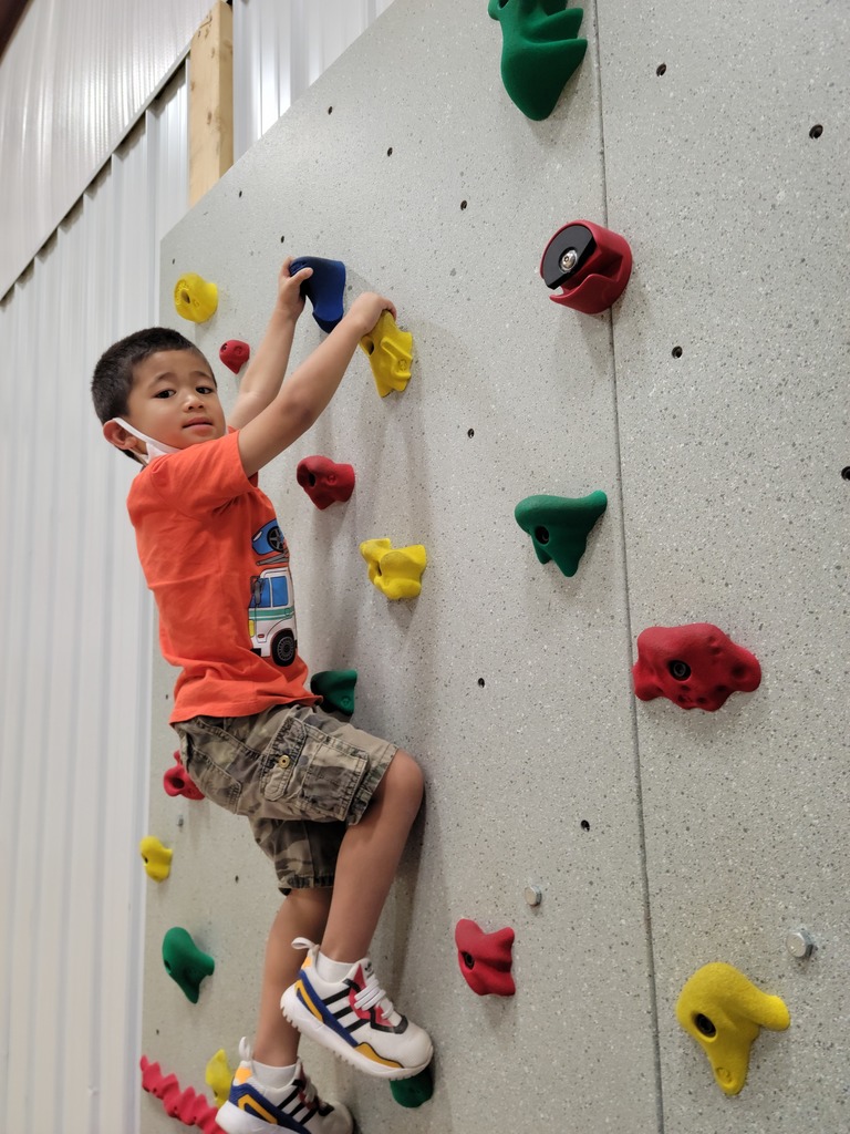 Student climbs our rock wall 