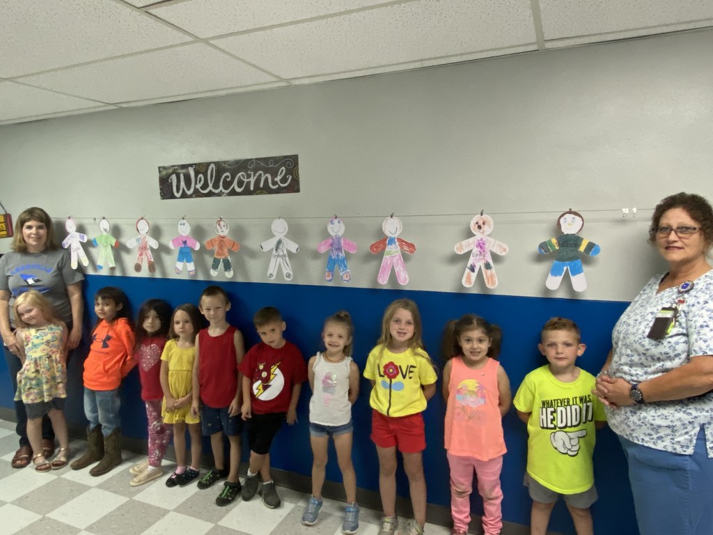 Mrs. Russell’s Kindergarten class made self-portrait paper dolls. They are enjoying Learning Centers and Calendar time in class. 