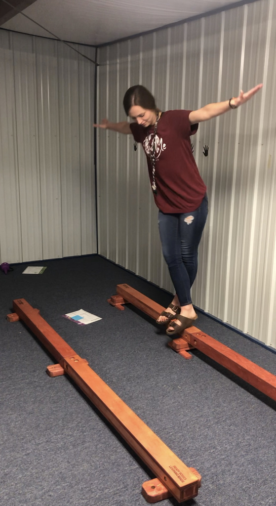 Mrs. Conway attempts the balance beam