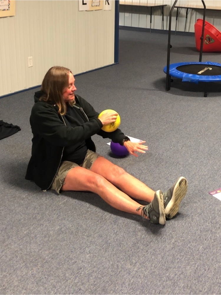 Mrs. Ruby tests her sensory and motor control control with a ball