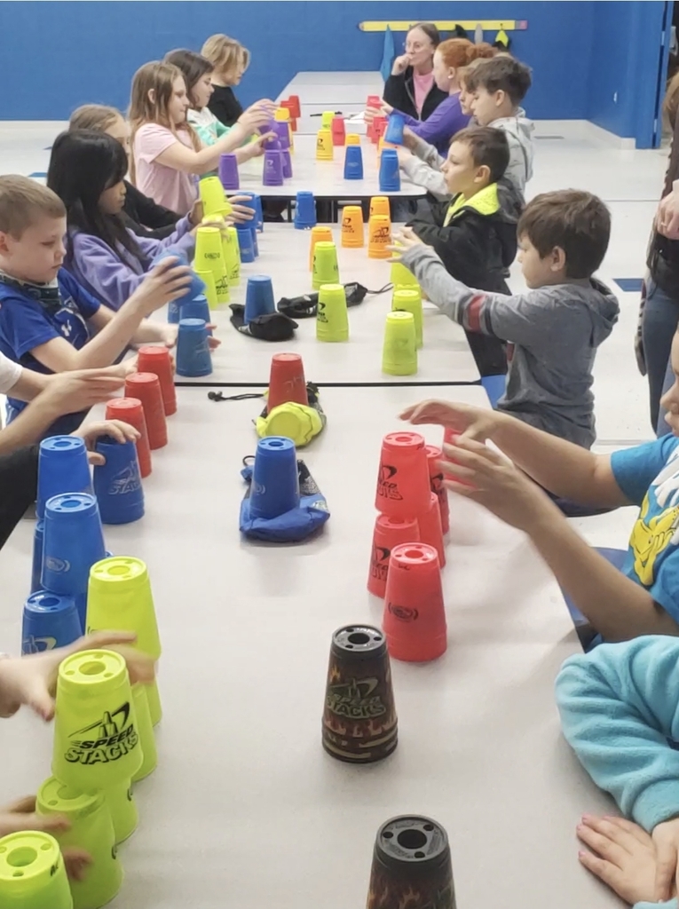 Students playing a cup stacking game
